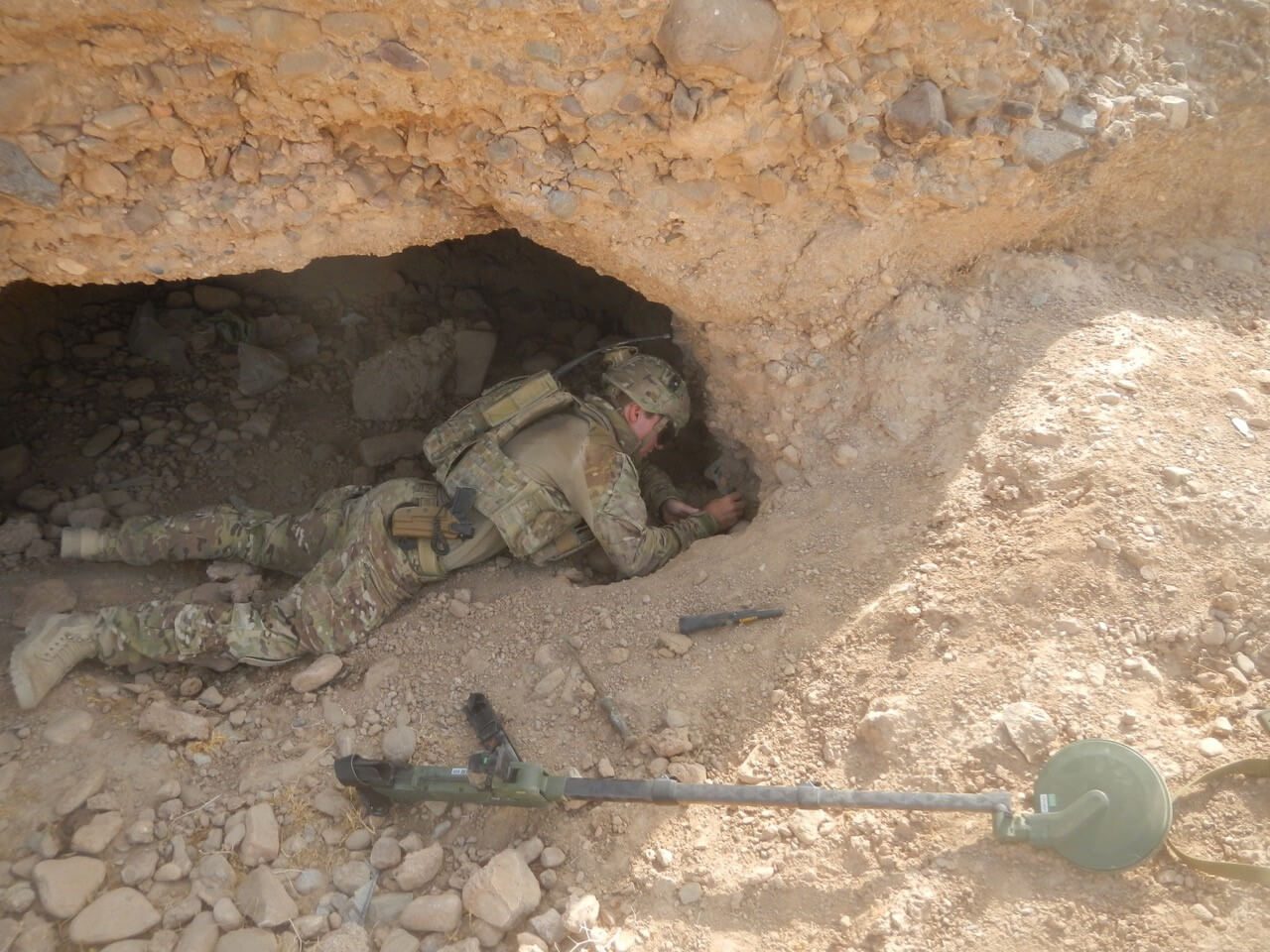 SPR Damien Gower, 5 Section, 2 Troop exploiting a detection  in Uruzgan Province in 2013.
